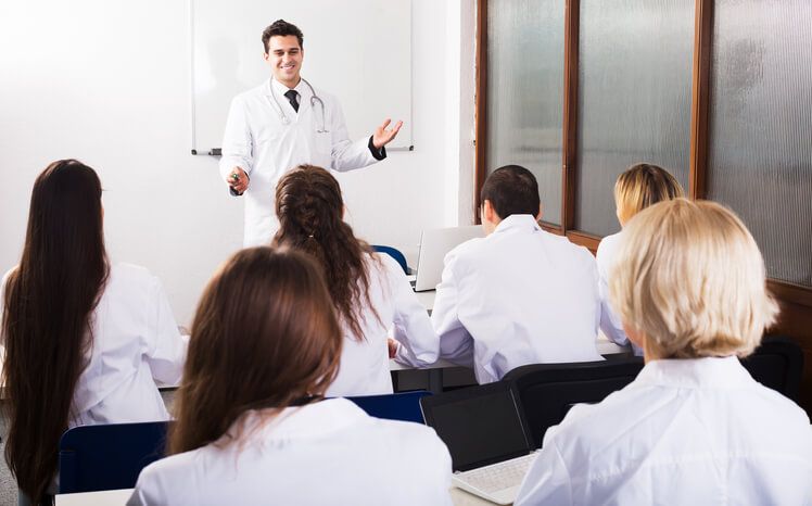 A budding healthcare professional making a presentation during healthcare training